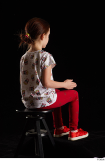 Lilly  1 dressed red leggings red shoes sitting t…